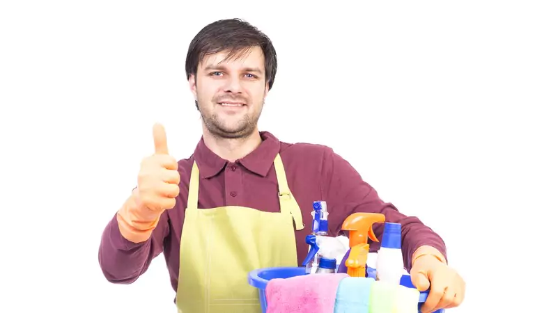 young man with some cleaning supplies ready for cleaning